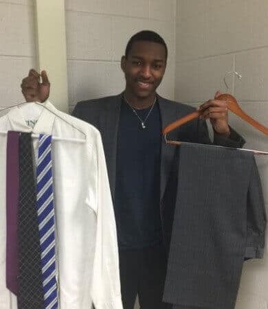 Christian Jackson, student from Community High School, with his new Project Pinstripe Suit.